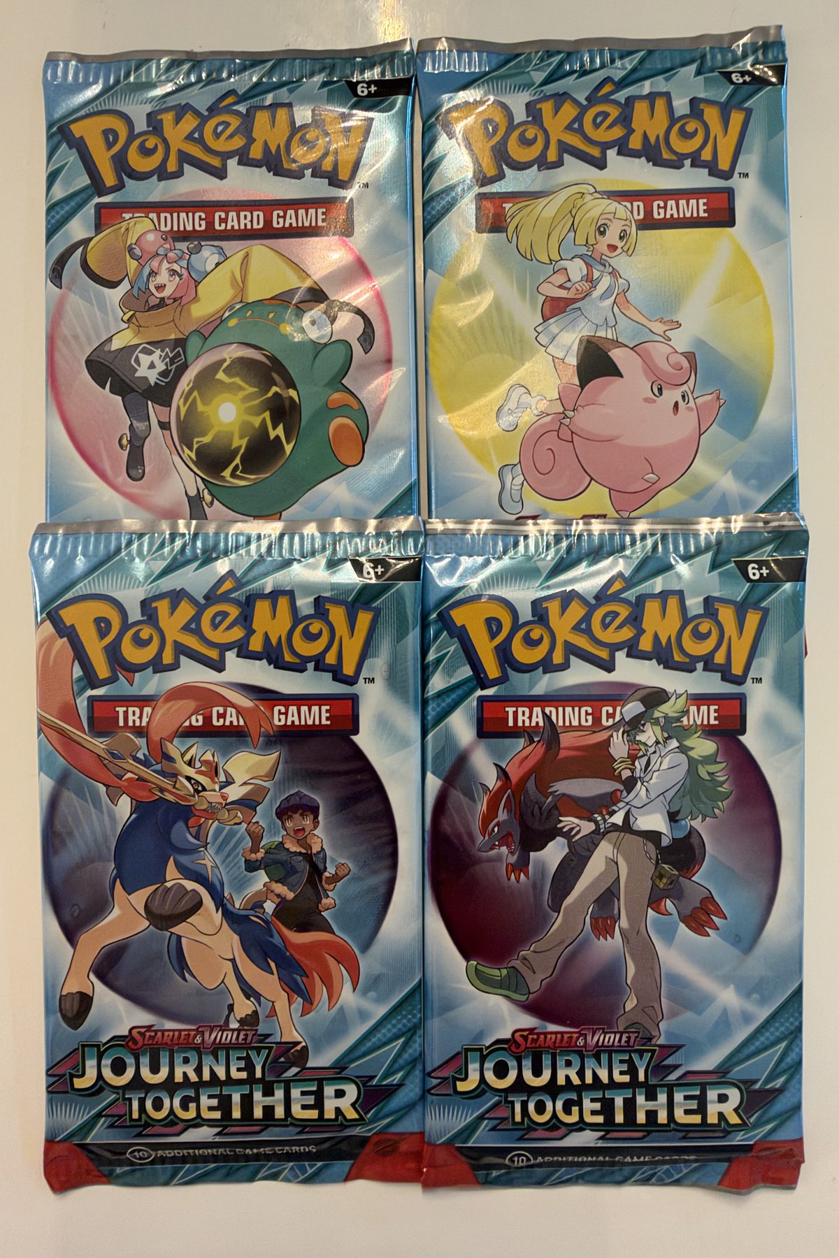 The four Journey Together wrapper designs